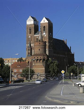 Stock Photo - Cars on road in front of cathedral, Brandenburg, Germany . Fotosearch