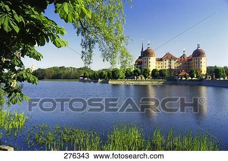 Stock Image - Castle at waterfront, Moritzburg Castle, Dresden, Saxony, Germany . Fotosearch