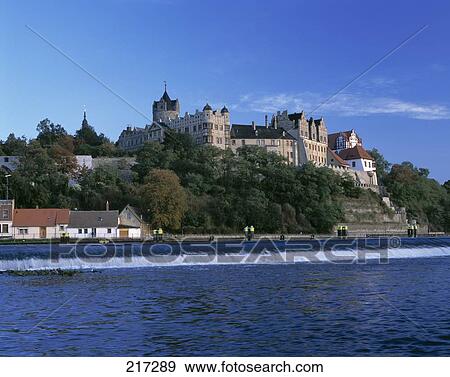 Castle on hill at riverside, Bernburg Scloss, Bernburg, Germany View Large Photo Image Stock Photo - Castle on hill at riverside, Bernburg Scloss, Bernburg, Germany . Fotosearch