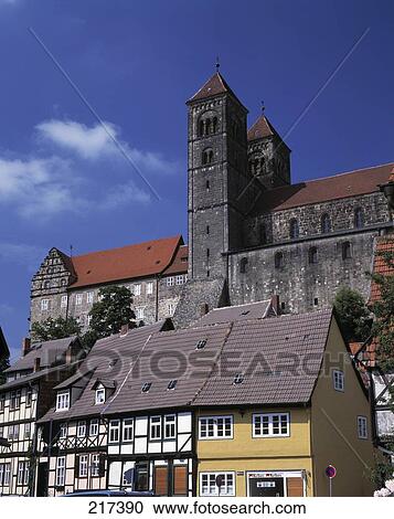 Cathedral behind houses in town View Large Photo Image Stock Image - Cathedral behind houses in town . Fotosearch