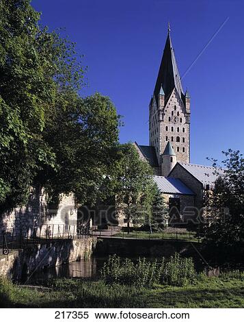 Stock Photography - Cathedral in town against blue sky . Fotosearch