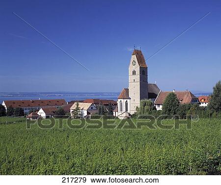 Cathedral in village against blue sky, Bodensee, Baden-Wurttemberg, Germany View Large Photo Image Stock Photo - Cathedral in village against blue sky, Bodensee, Baden-Wurttemberg, Germany . Fotosearch