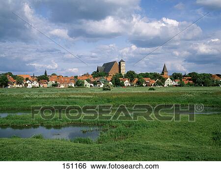 Cathedral in village under cloudy sky, Niedersachsen, Lower Saxony, Germany View Large Photo Image Stock Photograph - Cathedral in village under cloudy sky, Niedersachsen, Lower Saxony, Germany . Fotosearch