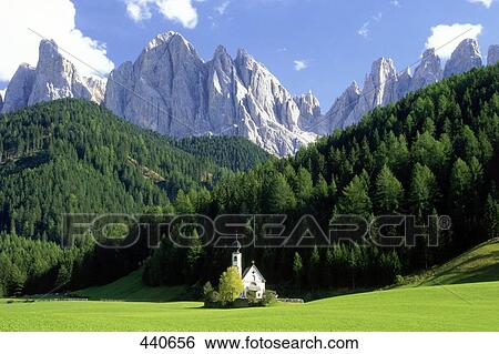 Stock Photograph - Chapel in field, St. Johann Chapel, Villnoesstal, Geislerspitzen, Trentino-Alto Adige, Italy . Fotosearch