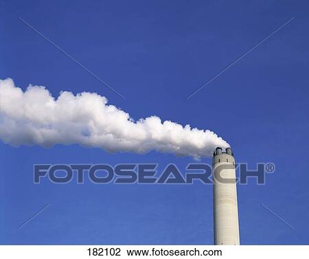 Chimney emitting smoke against blue sky, Germany View Large Photo Image Stock Image - Chimney emitting smoke against blue sky, Germany . Fotosearch