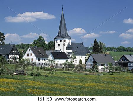 Church and houses in village on rural landscape, Germany View Large Photo Image Stock Image - Church and houses in village on rural landscape, Germany . Fotosearch