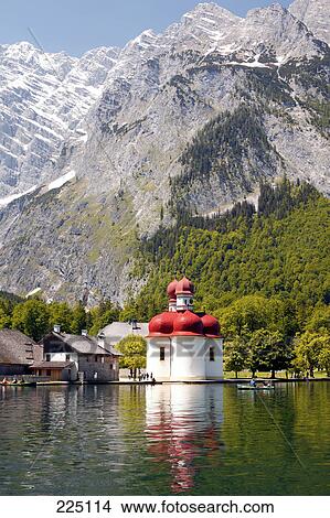 Church at the waterfront with mountains in the background, St. Bartholomae Church, Koenigssee, Bavaria, Germany View Large Photo Image Picture - Church at the waterfront with mountains in the background, St. Bartholomae Church, Koenigssee, Bavaria, Germany . Fotosearch