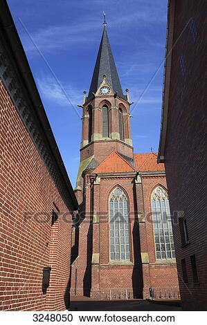 Stock Image - Church in Essen (Oldenburg), Germany, low angle view . Fotosearch