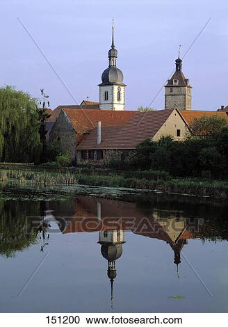 Church reflected in river, Prichsenstadt, Kitzingen, Lower Franconia, Germany View Large Photo Image Stock Image - Church reflected in river, Prichsenstadt, Kitzingen, Lower Franconia, Germany . Fotosearch