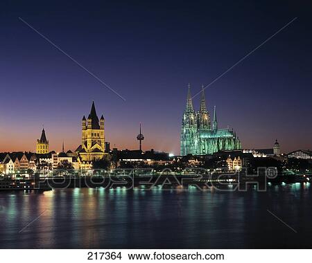 Picture - City at waterfront lit up at night, Bavaria, Germany . Fotosearch