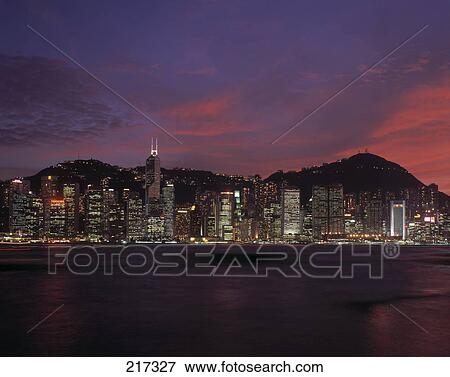 Stock Photo - City at waterfront lit up at night, China . Fotosearch