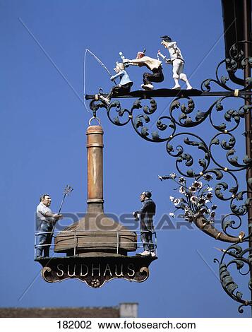 Stock Image - Close-up of figurines decorated signboard, Black Forest, Baden-Wurttemberg, Germany . Fotosearch