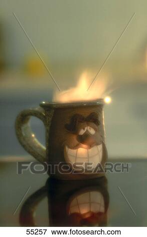 Stock Photo - Close-up of Halloween cup with candle . Fotosearch