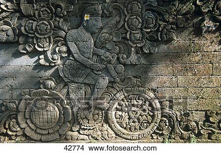 Picture - Close-up of relief of bicycle, Kubutambahan, Pura Maduwe Karang Temple, Kubutambahan, Bali, Indonesia . Fotosearch