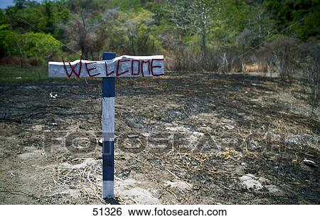Stock Photograph - Close-up of welcome sign, Satonda Island, Indonesia, Asia . Fotosearch