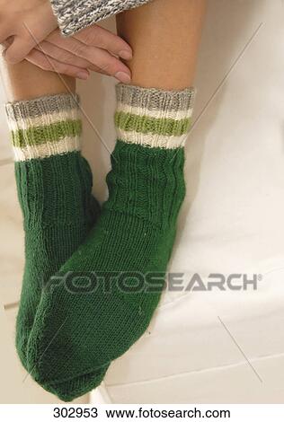 Close-up of woman wearing socks View Large Photo Image Stock Image - Close-up of woman wearing socks . Fotosearch