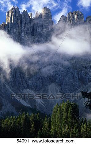 Clouds over mountain, Mt Latemar, Dolomites, Italy View Large Photo Image Stock Image - Clouds over mountain, Mt Latemar, Dolomites, Italy . Fotosearch