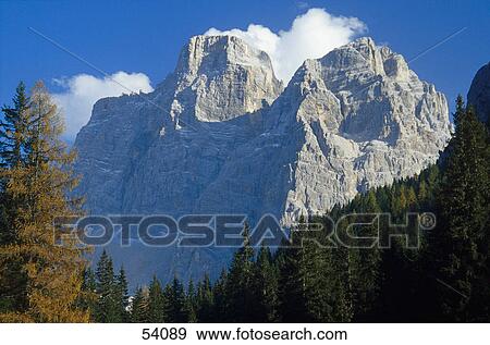 Stock Photo - Clouds over mountains, Mt Pelmo, Dolomites, Italy . Fotosearch