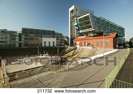 Stock Image - Construction site surrounded by buildings, Rhine River, Media Harbour, Dusseldorf, North Rhine-Westphalia, Germany . Fotosearch