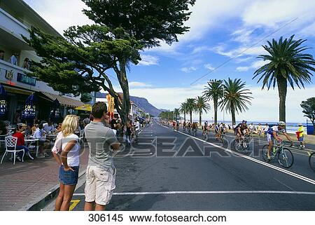 Couple watching bicycle race, Cape Argus Cycle Race, Cape Town, Western Cape Province, South Africa View Large Photo Image Stock Photography - Couple watching bicycle race, Cape Argus Cycle Race, Cape Town, Western Cape Province, South Africa . Fotosearch