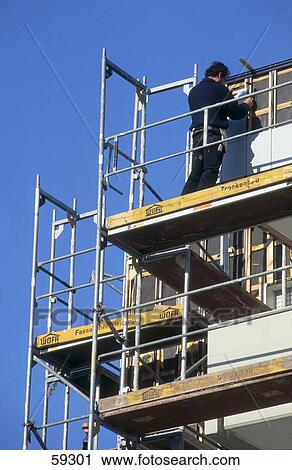 Craftsman on scaffolding, Stuttgart, Germany View Large Photo Image Stock Image - Craftsman on scaffolding, Stuttgart, Germany . Fotosearch