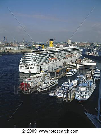 Stock Photo - Cruise ship and tourboats at harbor, St Pauli, Hamburg, Germany . Fotosearch