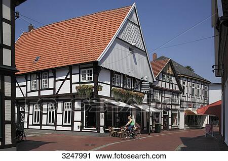 Cyclist in a shopping street, Quakenbrueck, Germany View Large Photo Image Stock Image - Cyclist in a shopping street, Quakenbrueck, Germany . Fotosearch