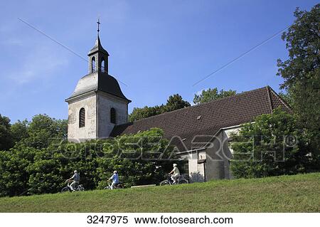 Cyclists in front of a church, Duisburg, Germany, low angle view View Large Photo Image Stock Photography - Cyclists in front of a church, Duisburg, Germany, low angle view . Fotosearch