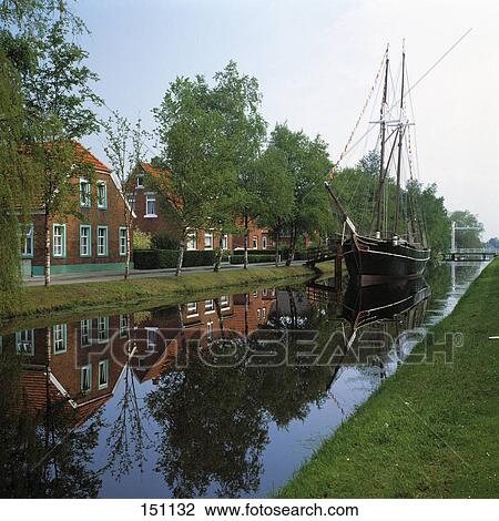 Fishing boat in canal, Papenburg, Emsland, Lower Saxony, Germany View Large Photo Image Stock Image - Fishing boat in canal, Papenburg, Emsland, Lower Saxony, Germany . Fotosearch