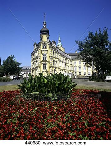 Stock Image - Flowers blooming in front of building . Fotosearch