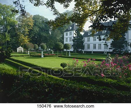Stock Photograph - Formal garden in front of castle, Panker, Schleswig-Holstein, Germany . Fotosearch
