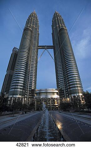 Stock Image - Fountain in front of towers, Petronas Twin Towers, Kuala Lumpur, Malaysia . Fotosearch