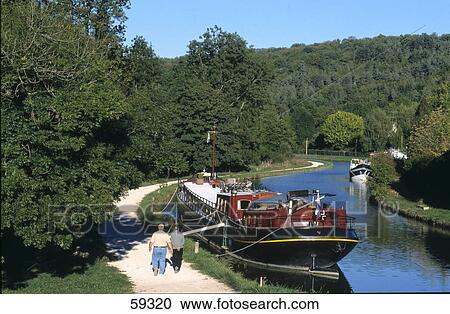 Freight ship in canal, Canal de Bourgogne, Burgundy, France View Large Photo Image Stock Image - Freight ship in canal, Canal de Bourgogne, Burgundy, France . Fotosearch