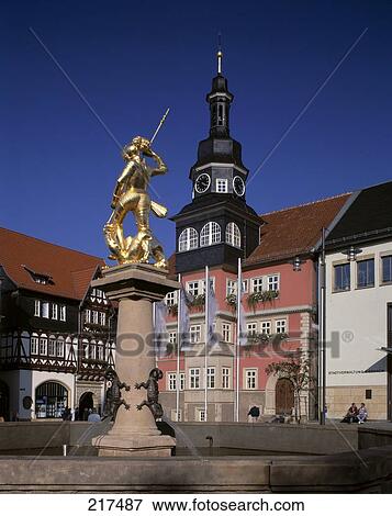 Stock Photo - Georgsbrunnen fountain statue in front of city hall, St George Church, Eisenach, Thuringia, Germany . Fotosearch