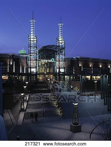 Stock Image - Group of people in front of lit up building, Germany . Fotosearch
