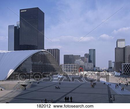 Stock Image - Group of people in front of modern buildings, Paris, France . Fotosearch