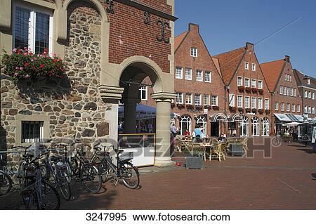 Group of people in pavement cafe at the town hall, Meppen, Germany View Large Photo Image Stock Photography - Group of people in pavement cafe at the town hall, Meppen, Germany . Fotosearch