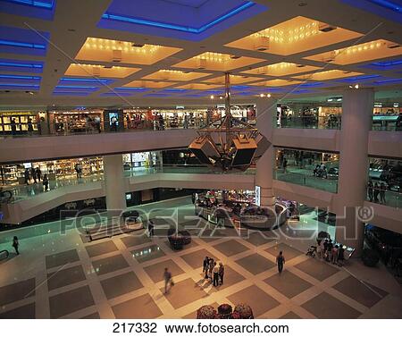 Stock Image - Group of people inside shopping mall, China . Fotosearch