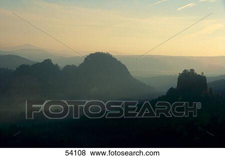 Stock Photo - Haze covering mountain range, Saxony, Germany . Fotosearch