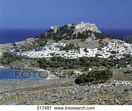 Stock Photo - High angle view of a town at the hillside, Lindos, Rhodes, Dodecanese Islands, Southern Aegean, Greece . Fotosearch