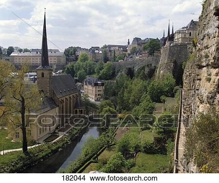 Picture - High angle view of canal flowing through city, Alzette Valley, Luxembourg . Fotosearch