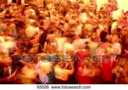 Stock Photograph - High angle view of crowd of people dancing in party . Fotosearch