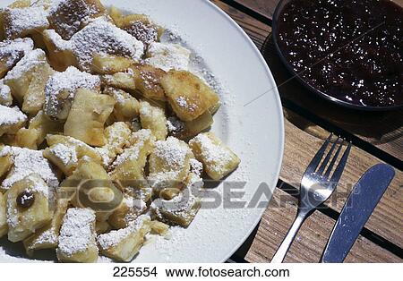 Picture - High angle view of dough cookies with castor sugar and jam . Fotosearch