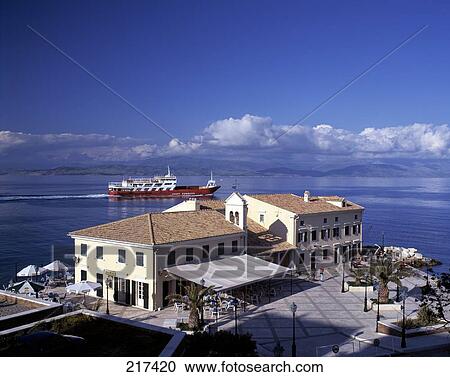 High angle view of resort with ferry in background, Corfu, Ionian Islands, Greece View Large Photo Image Stock Image - High angle view of resort with ferry in background, Corfu, Ionian Islands, Greece . Fotosearch