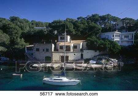 Stock Photo - High angle view of sailboat in bay, Cala Figuera, Majorca, Balearic Islands, Spain . Fotosearch