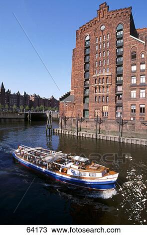 Stock Image - High angle view of tourboat, Speicherstadt, Hamburg, Germany . Fotosearch
