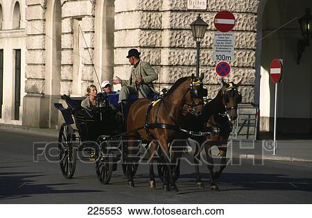 Stock Image - Horsedrawn moving on road, Vienna, Austria . Fotosearch