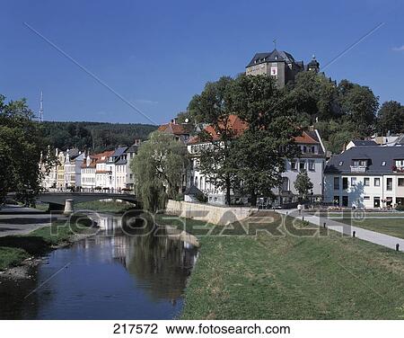 Stock Image - Houses along river in town, Weisse Elster River, Vogtland, Thuringia, Germany . Fotosearch