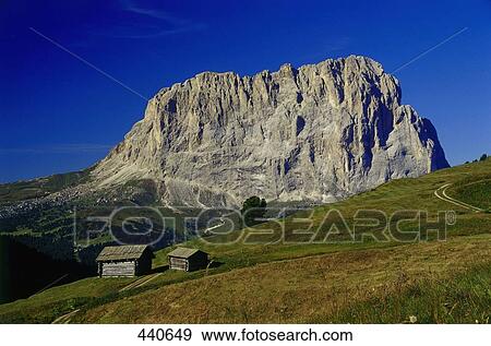 Stock Photo - Huts on hill, Mt Langkofel, Dolomites, Trentino-Alto Adige, Italy . Fotosearch