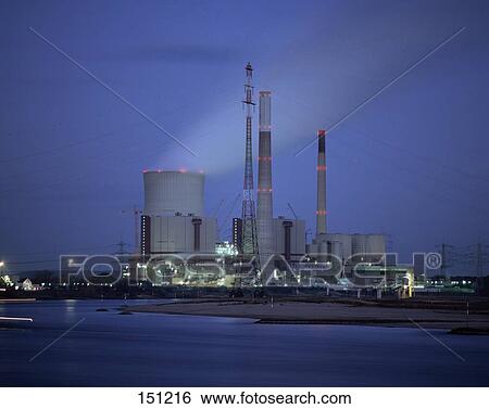Stock Photograph - Industrial plant at riverside, Rhine River, Voerde, Rhine-Westphalia, Germany . Fotosearch